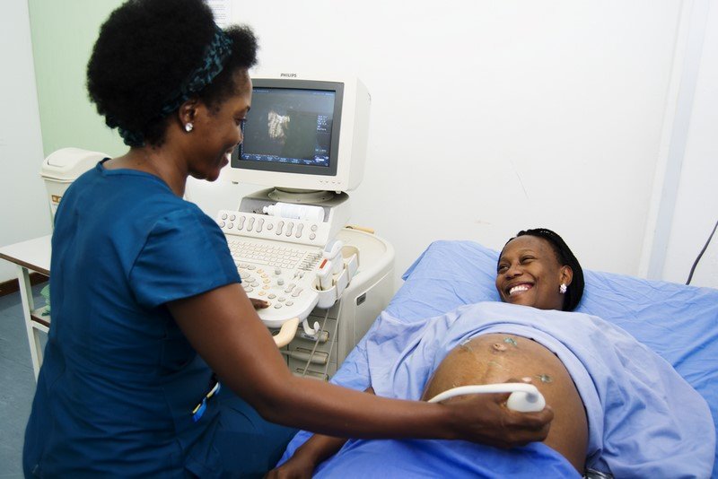 Sonographer performing a pregnancy ultrasound scan