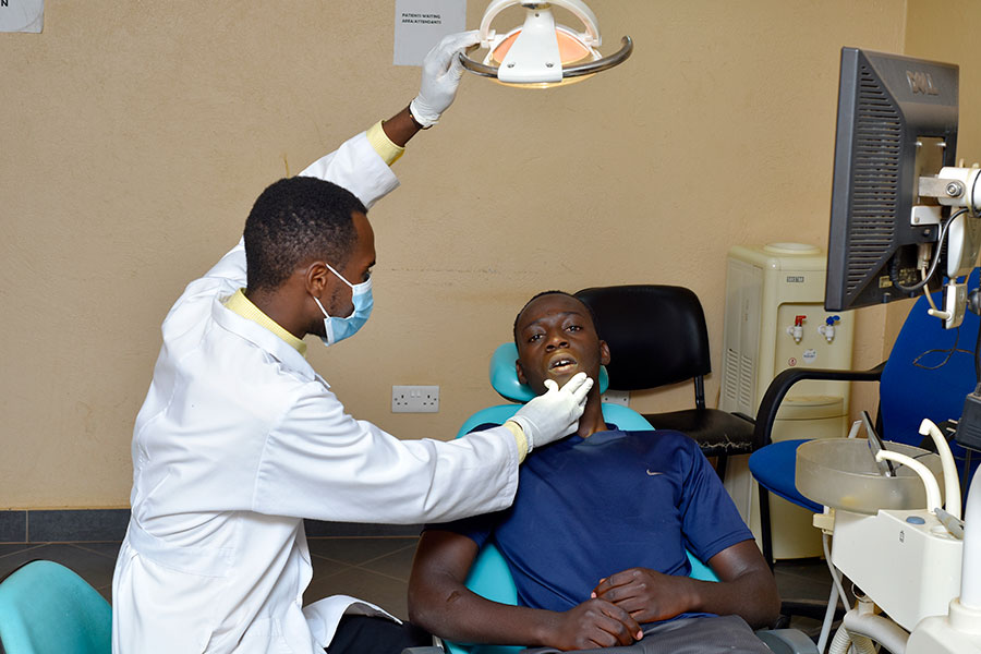 Dentist treating a patient in a dental chair