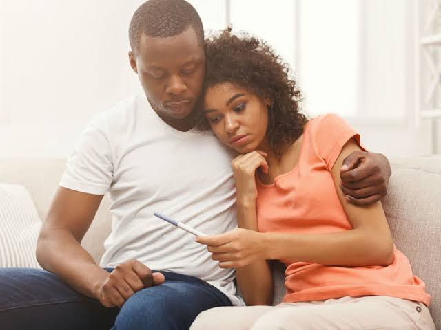 Couple looking at a pregnancy test together